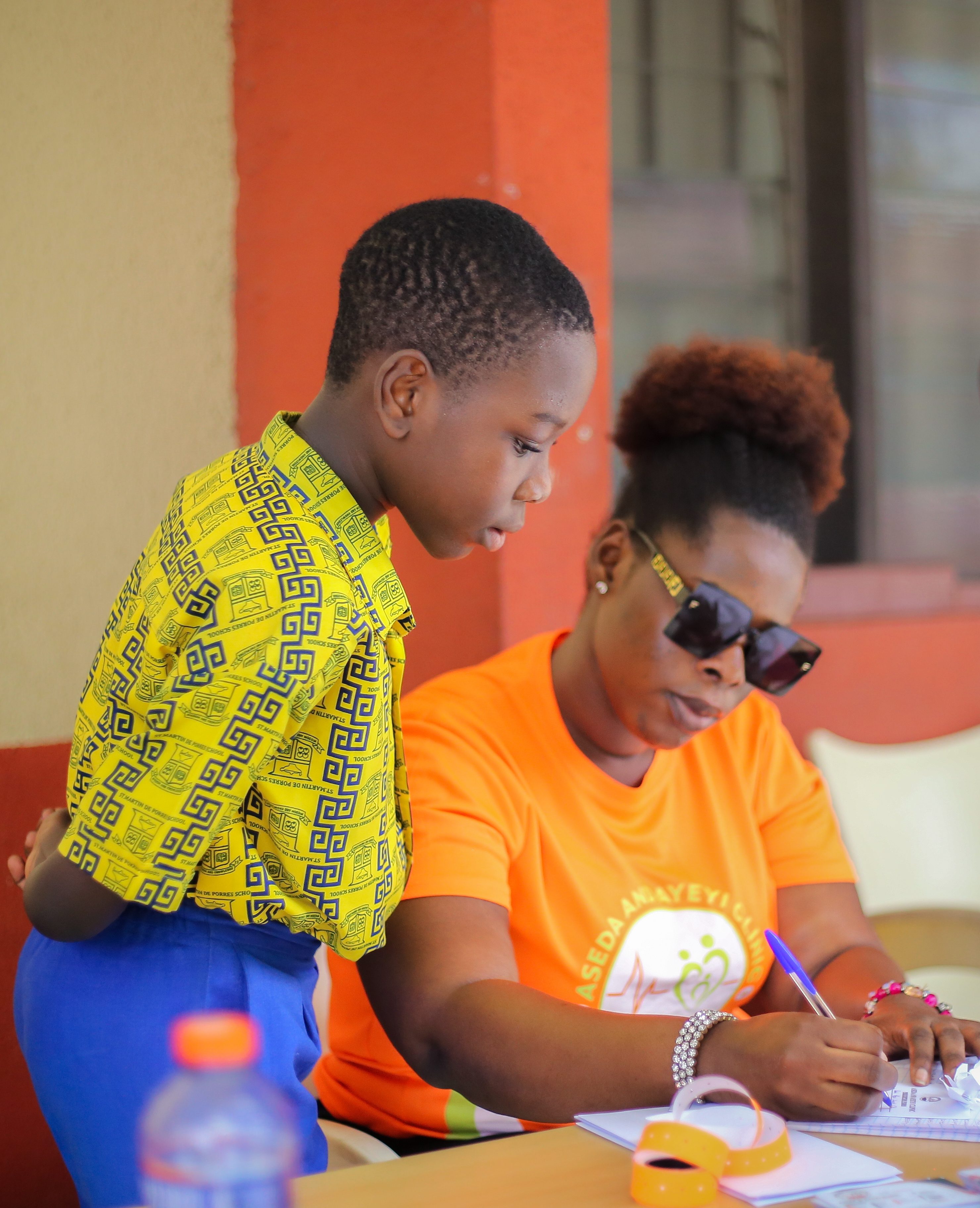 A nurse examining a young patient